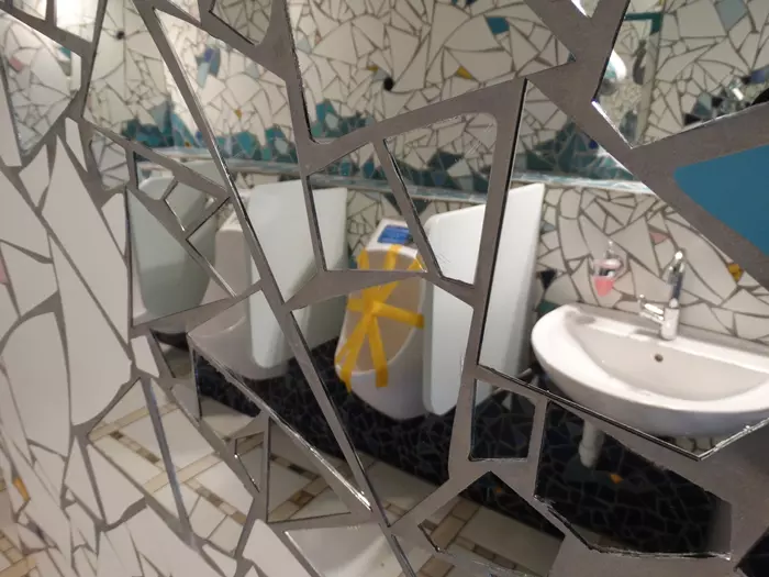 Public toilet with mirror mosaics